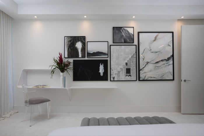 Gallery Wall on Guest Bedroom interior at Auberge Beach Residences by DKOR Interiors in Fort Lauderdale, FL