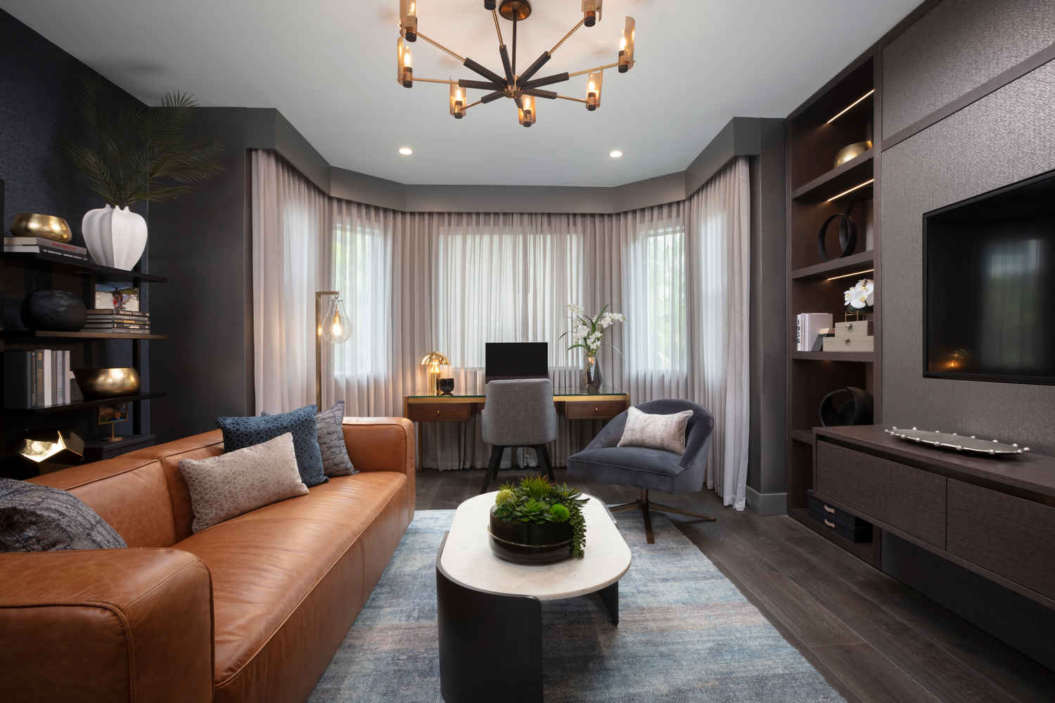 living room, eclectic, gray room, dark room, leather couch, bookshelf,