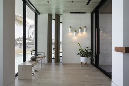 Entry foyer with a modern design and timeless details in a Florida waterfront residence