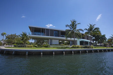 Florida waterfront property in Fort Lauderdale with modern industrial home exterior