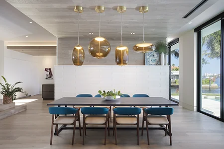 Dining room with a pop of color in a Florida waterfront residence