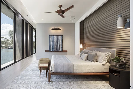 Stylish modern industrial master bedroom by Fort Lauderdale luxury design firm