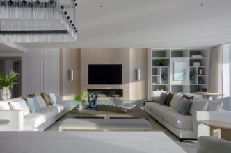 Living room with ocean view in a Bal Harbour luxury home renovation by DKOR Interiors.