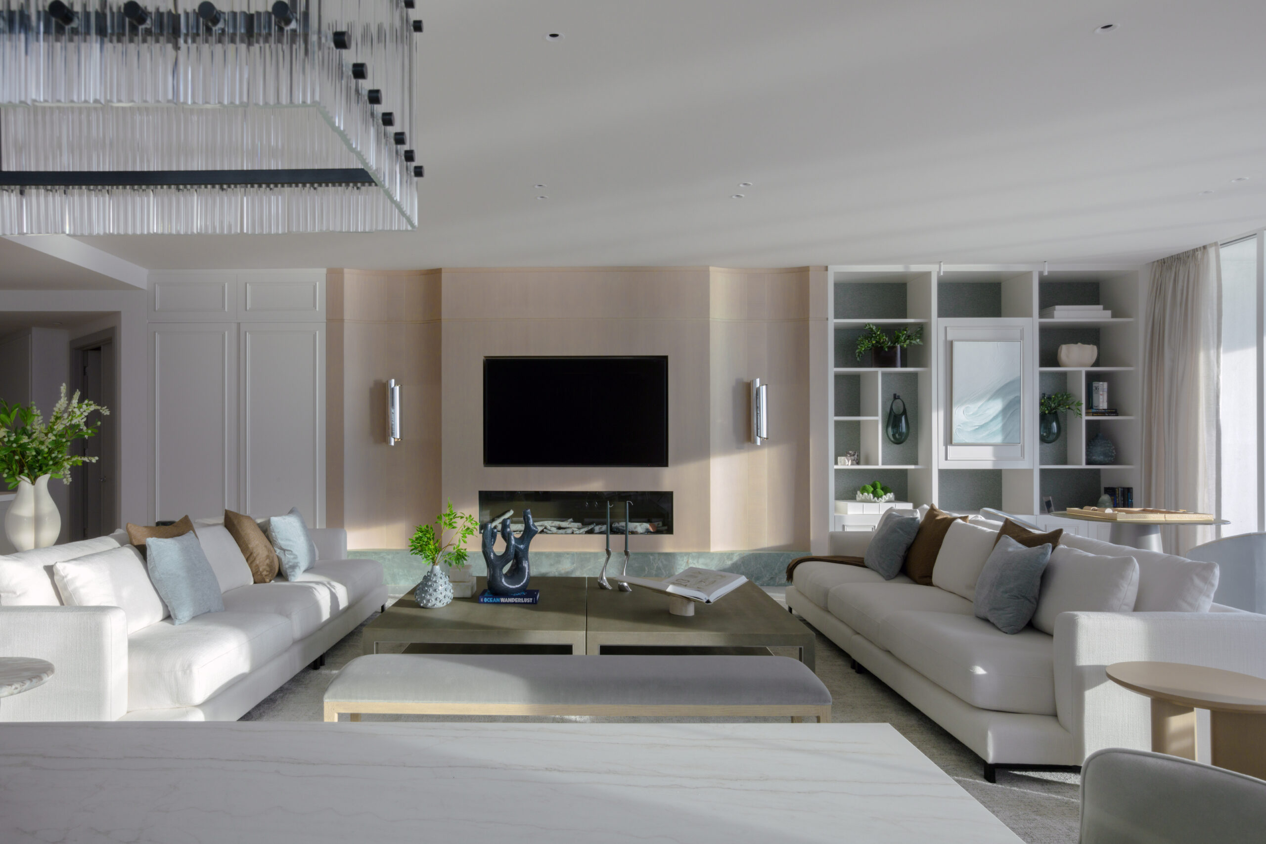 Living room with oceanfront view in a luxury home renovation in Bal Harbour by DKOR Interiors.