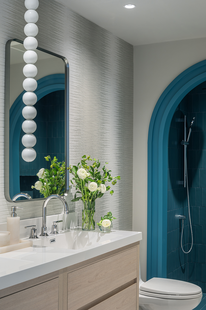 Composite view of custom bathroom vanity and bedroom paneling in a Miami luxury condo.