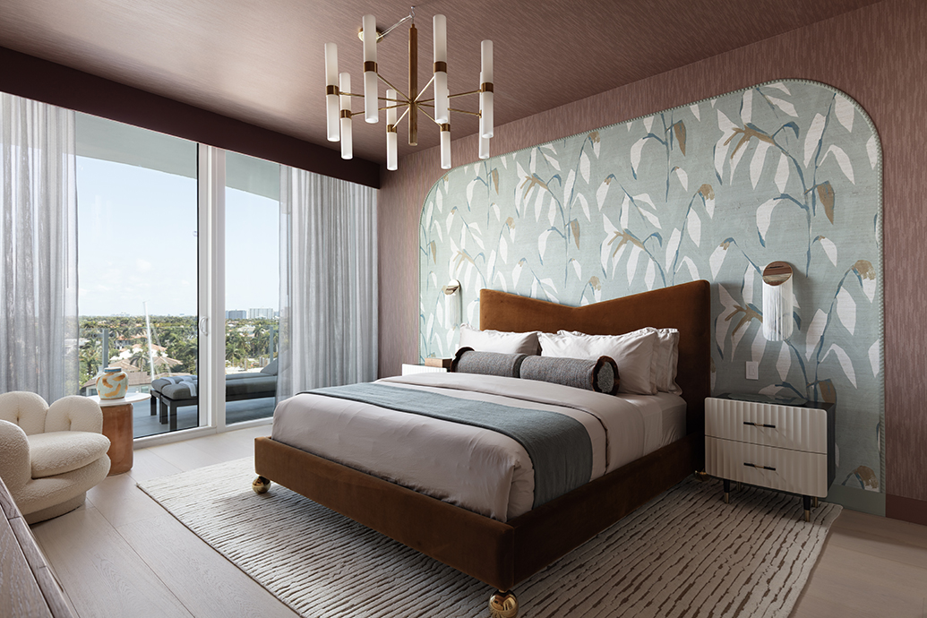Creative ways to use wallpaper on a bedroom feature wall framed inside a large curved arch molding.