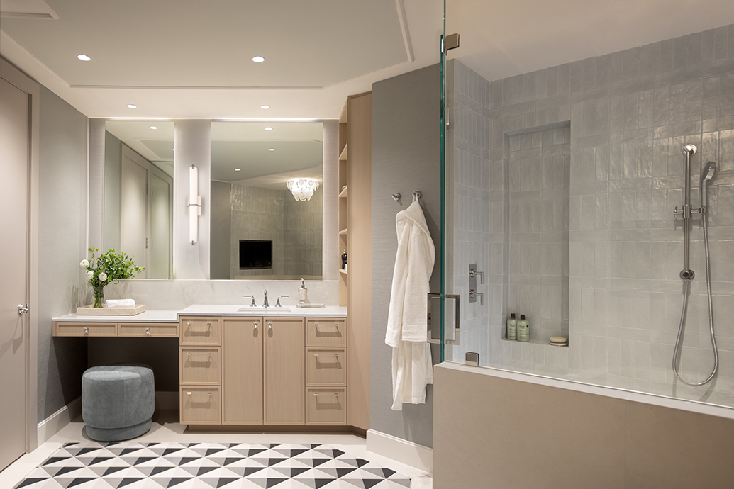 Open-concept living space in a luxury oceanfront condo renovation in Miami featuring custom architectural millwork.