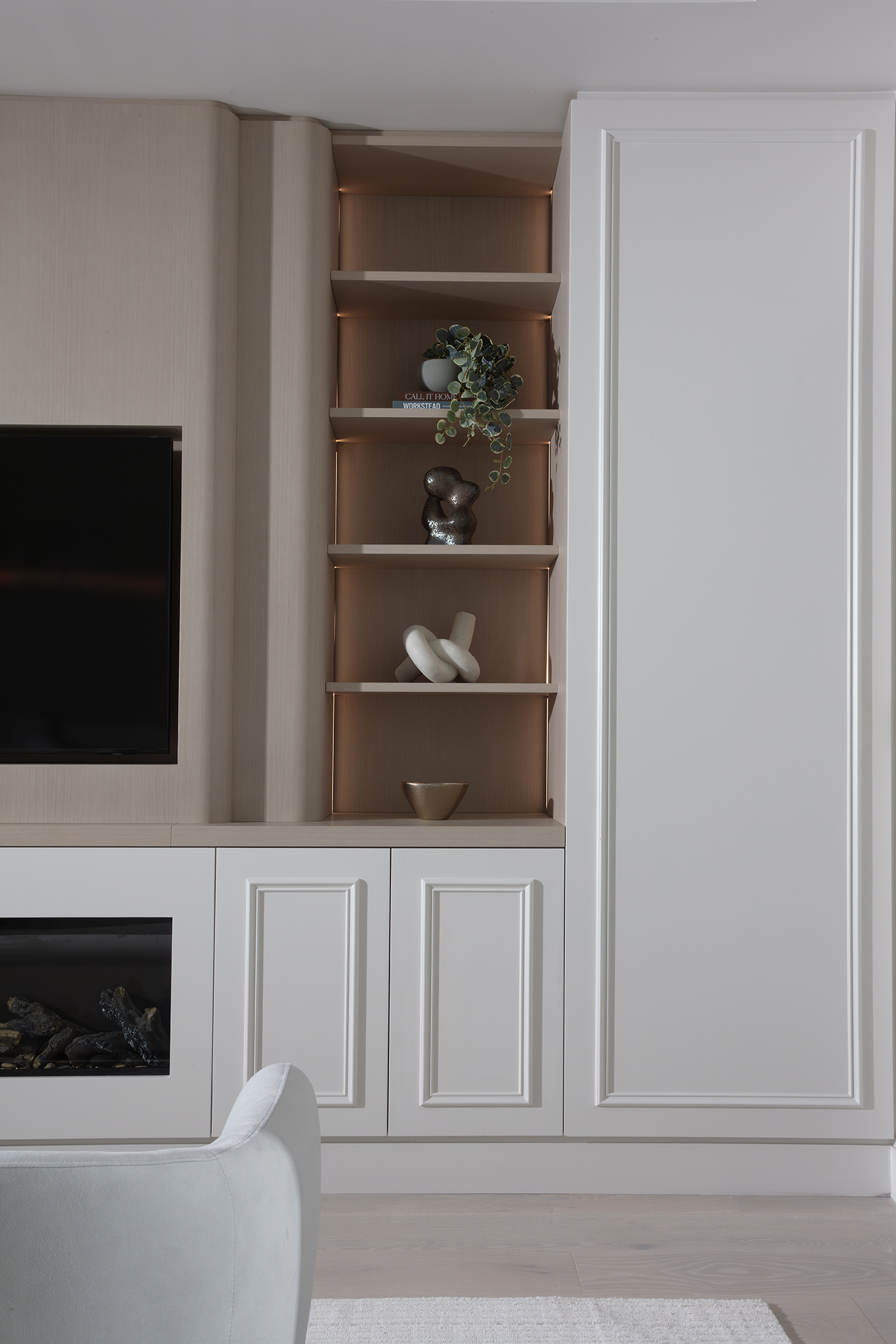 Luxurious interior materials including cream marble, wheat lacquer, and engineered wood in a modern coastal home.