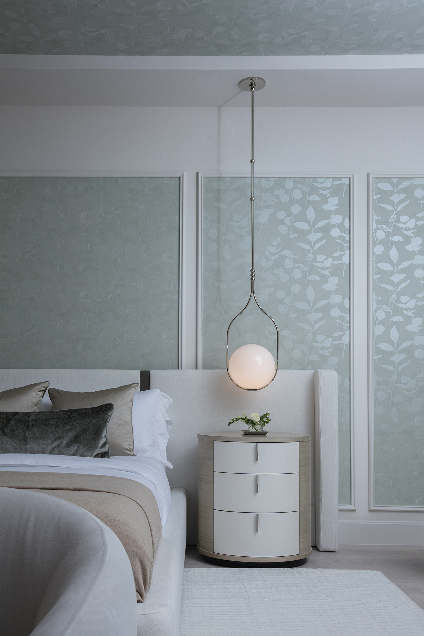 Luxurious interior materials including cream marble, wheat lacquer, and engineered wood in a modern coastal home.
