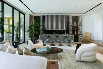 Open concept living room and bar area in a Venetian Islands home designed for entertaining