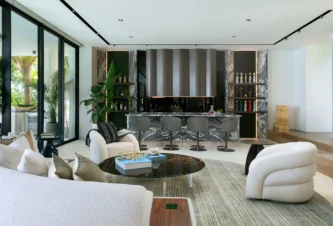 Open concept living room and bar area in a Venetian Islands home designed for entertaining
