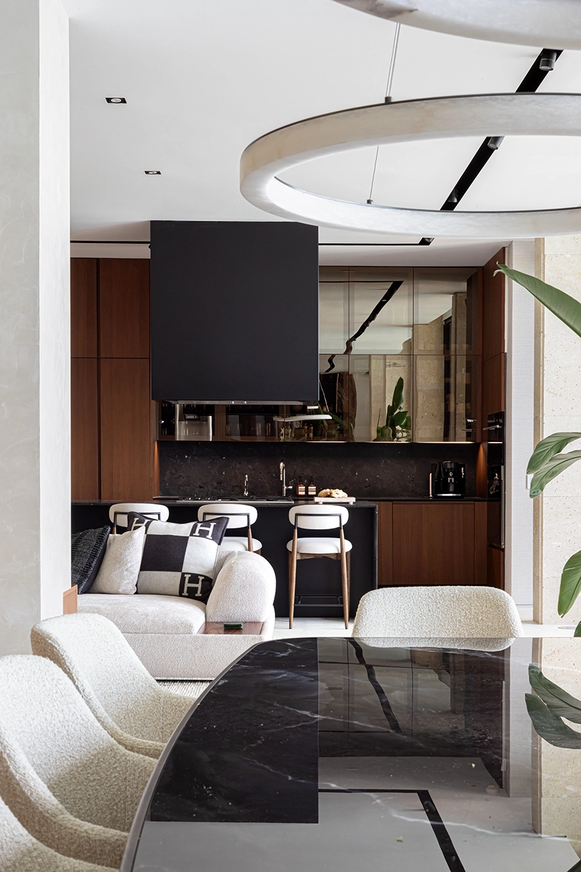 Dining table with ceramic stone top and view towards the open kitchen in Venetian Islands home