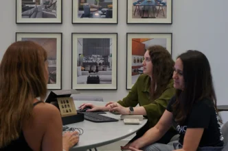 Design team reviewing floor plans, what does an interior designer do between meetings at DKOR Interiors