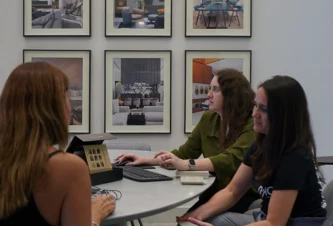 Design team reviewing floor plans, what does an interior designer do between meetings at DKOR Interiors